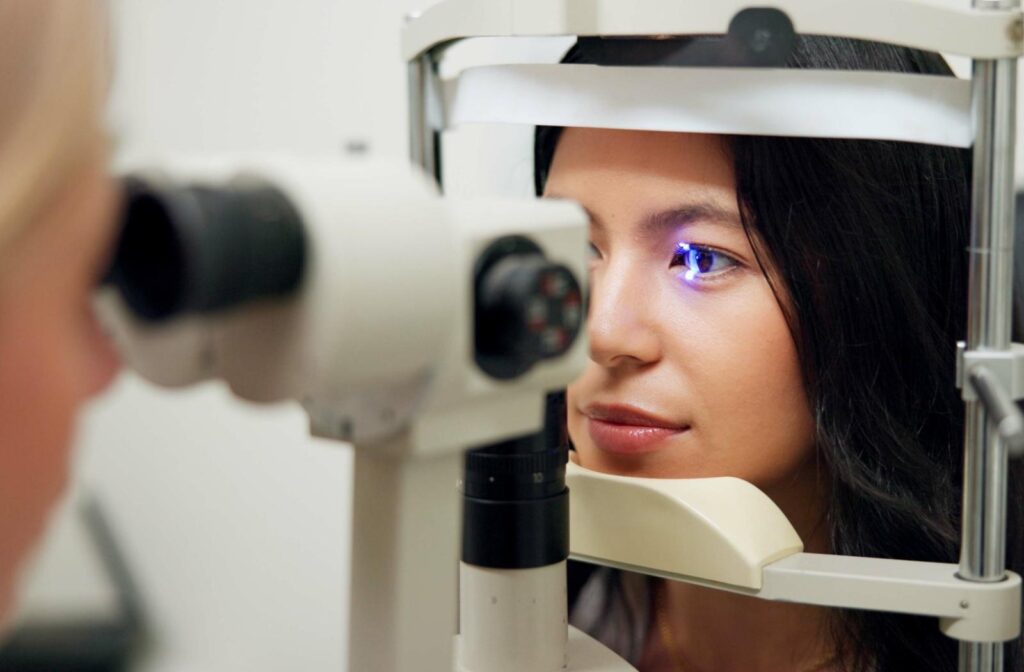 Patient receiving an eye exam with specialized equipment to assess keratoconus and explore treatment options.